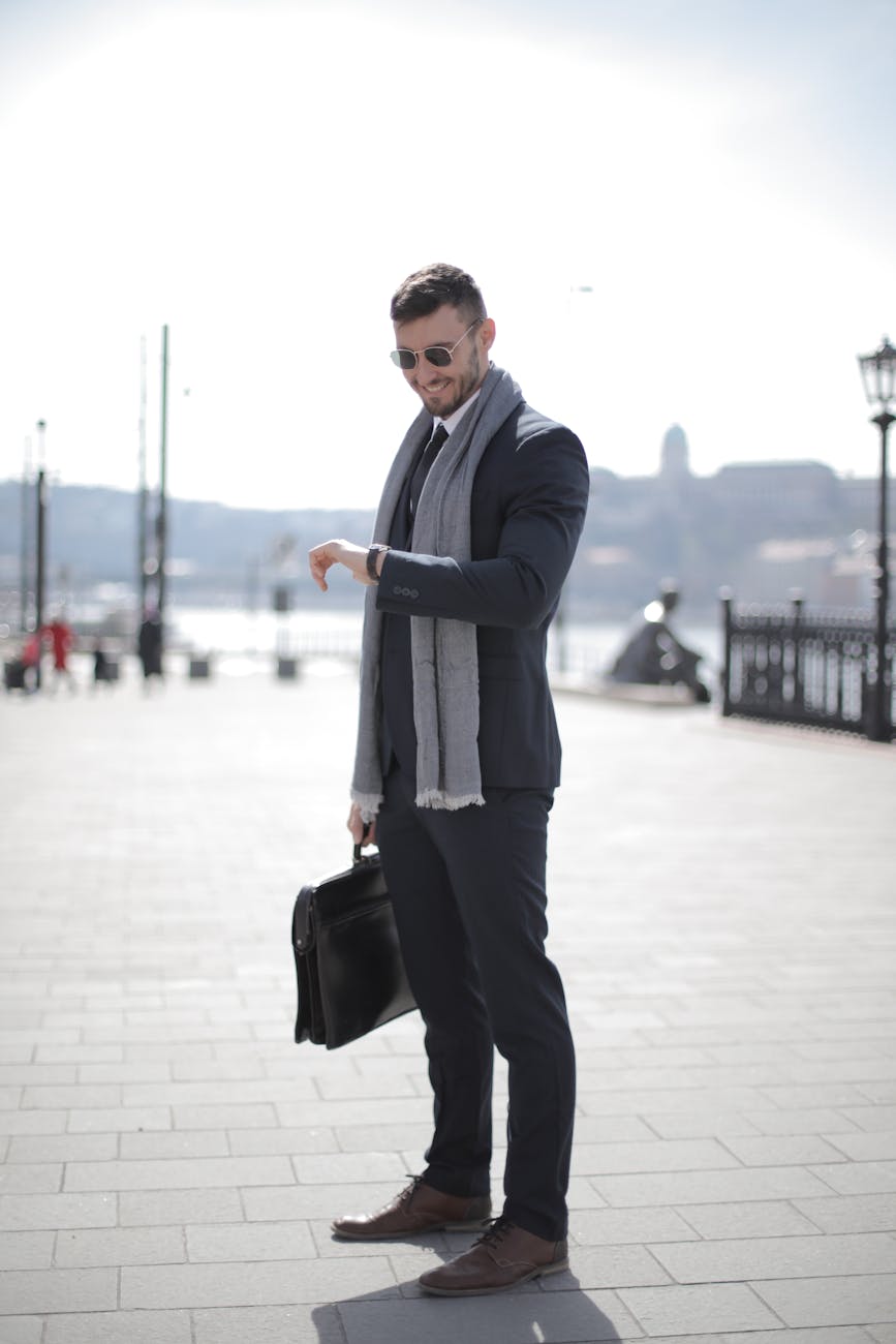 fashion-designer-34 man in black suit holding leather briefcase
